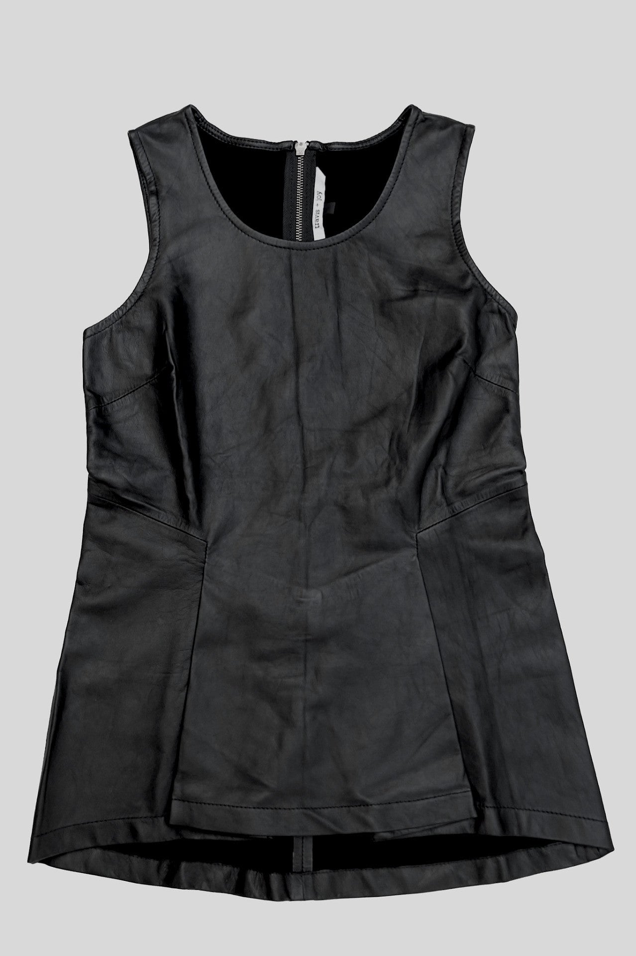 Structure leather peplum top available in black and grey. 100% authentic leather